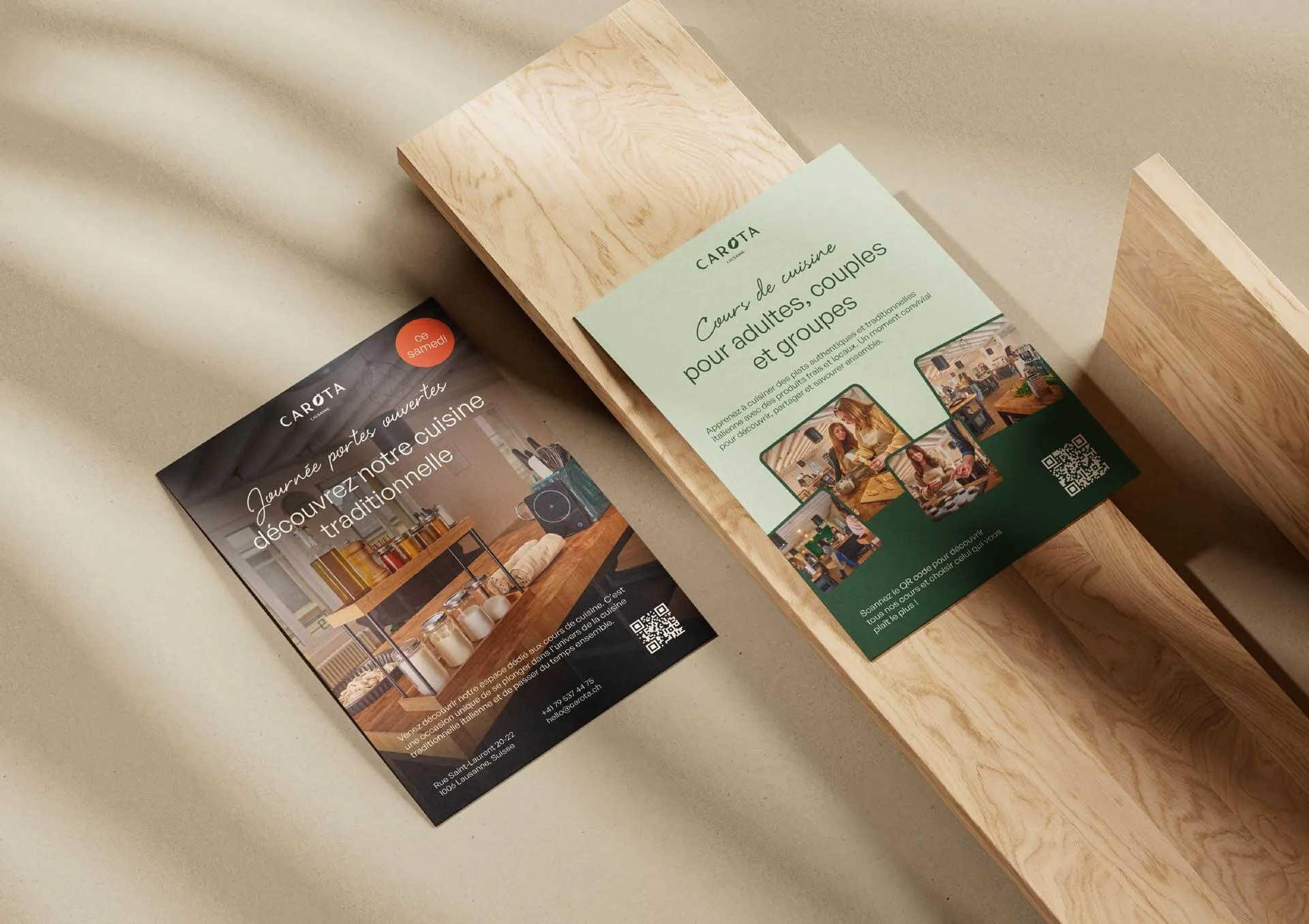 Two Carota cooking class flyers on a wooden bench, one promoting an open house event and the other advertising cooking courses for adults and groups.