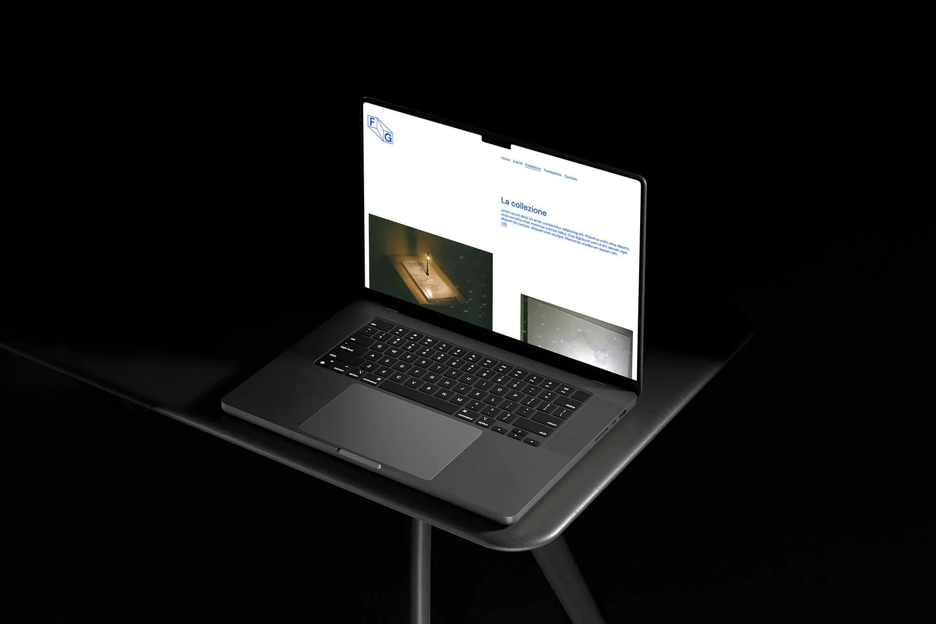 Black laptop open on a dark table displaying a webpage with the title 'La collezione' and images.