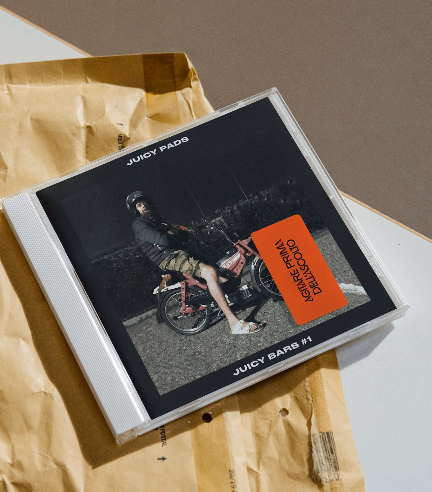 Juicy Bars #1 on CD, with the sticker: shake before listening