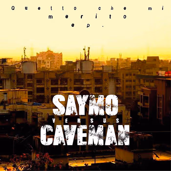 Urban cityscape at sunset with large white text 'SAYMO versus CAVEMAN' overlaid in the center and faint Italian text at the top.