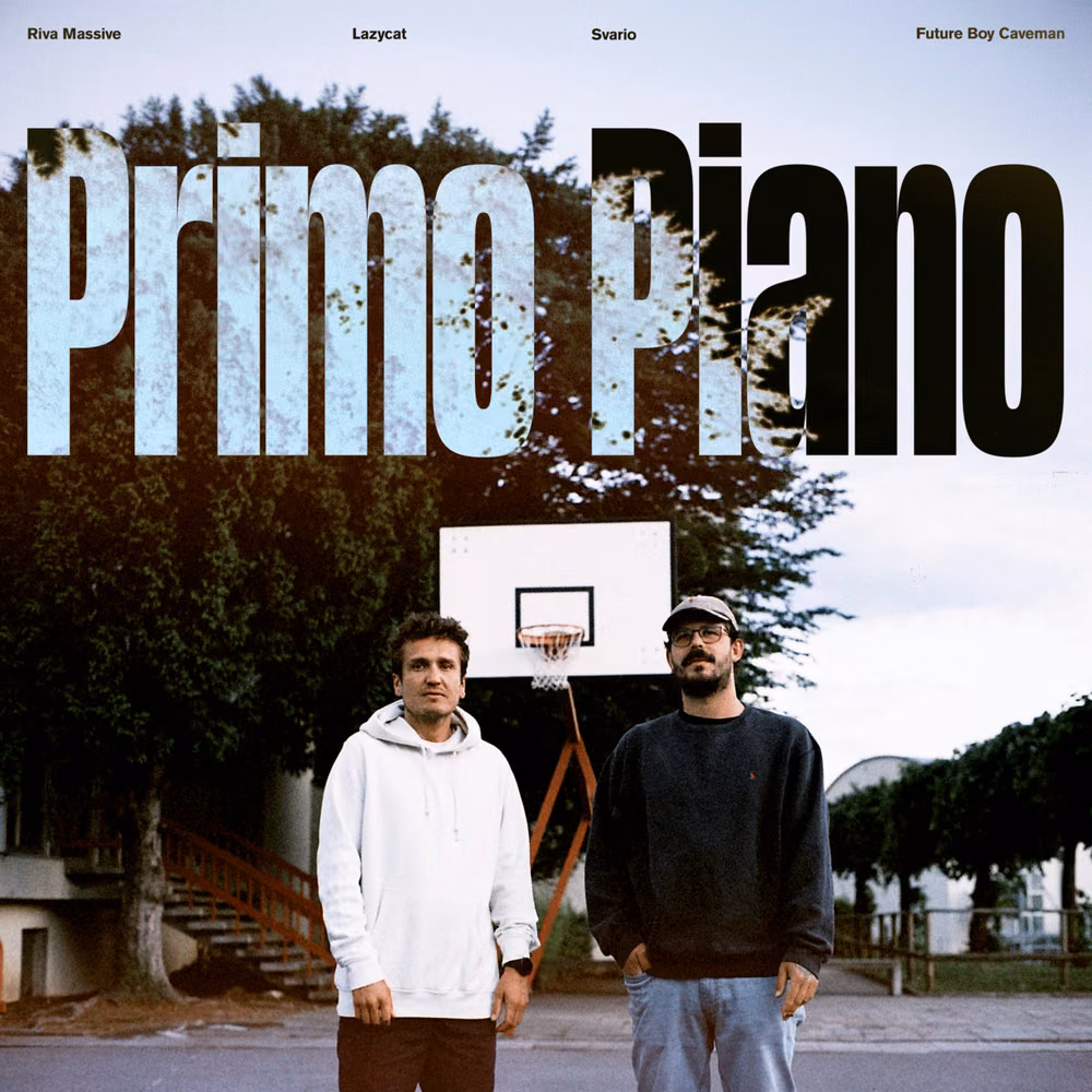 Two men standing on an outdoor basketball court under a hoop, with the title Primo Piano in large letters filled with the sky above them and the names Riva Massive, Lazycat, Svario and Future Boy Caveman at the top.