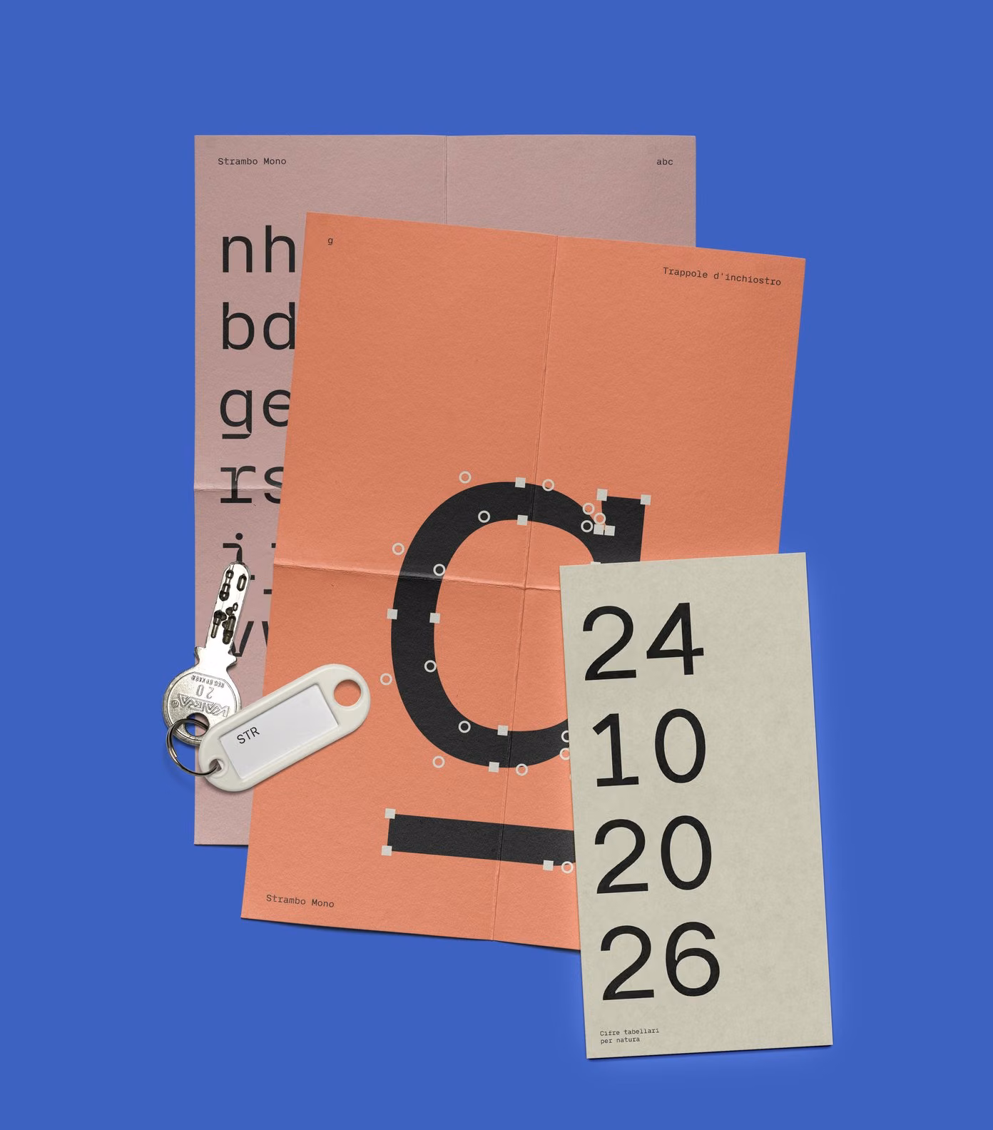 Papers on cobalt: a giant g with its points, the lowercase on pink and the figures 22 10 20 26